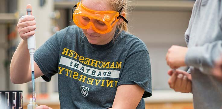 A Manchester University student measures carefully