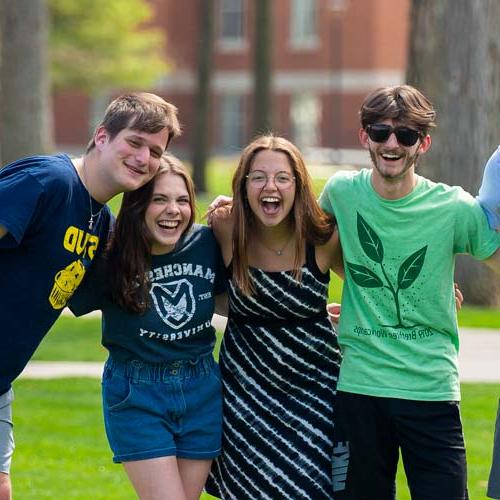 Photo of undergrad students after playing frisbee on the mall